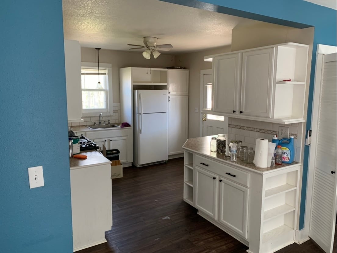 Kitchen with plenty of cabinet storage space. Window view into back yard. (Photo before deep clean) - 215 N 7th St