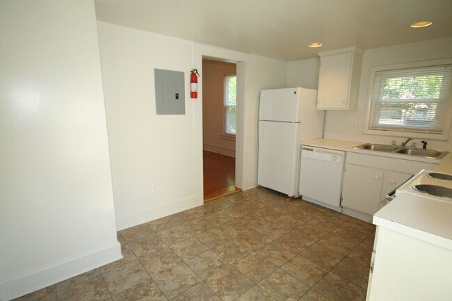 Building Photo - Half a block from Duke East. A bay window you'll love. A backyard that surprises you.