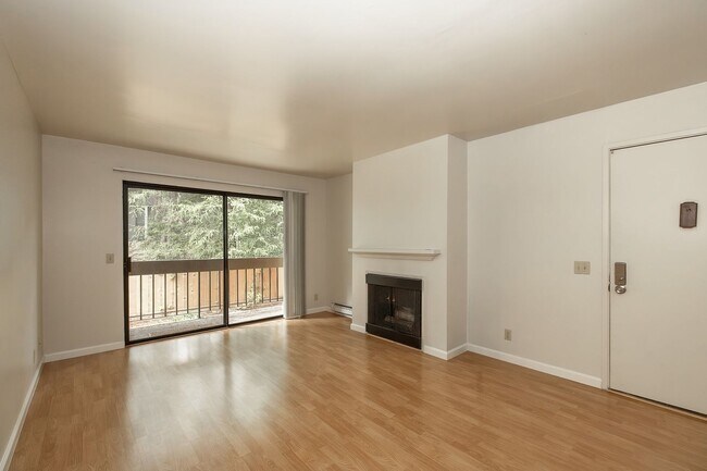 Building Photo - Peaceful Forest-View Condo with Fireplace & Private Balcony in Golden Oaks