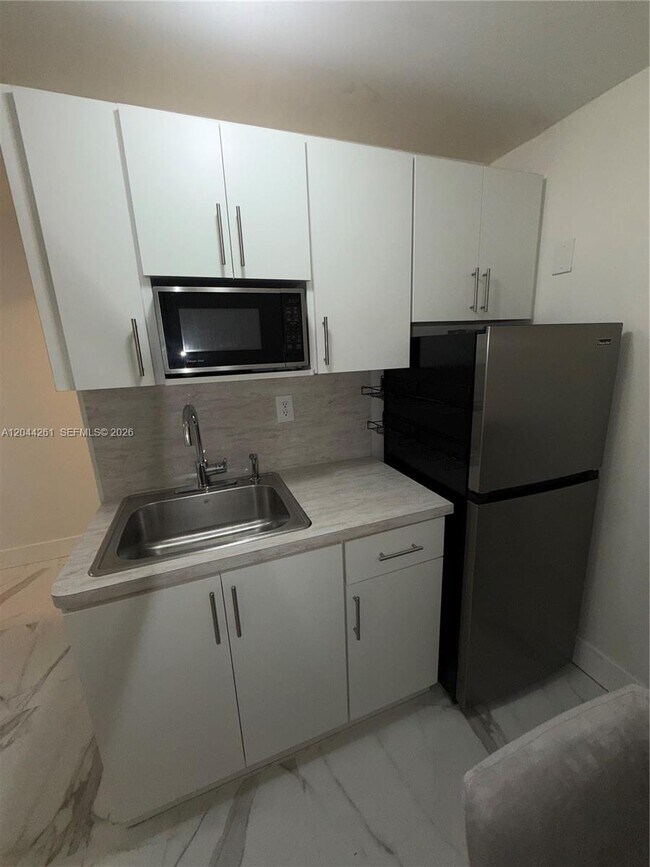 Building Photo - 6497 W 8th Ln