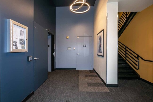 Building Photo - Gorgeous loft-style 2 floor condo with secured parking, A/C and rent includes most utilities!