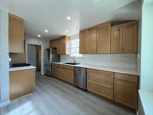 Building Photo - Upgraded 3+2 in Canoga Park w/central HVAC, wood floors + appliances!