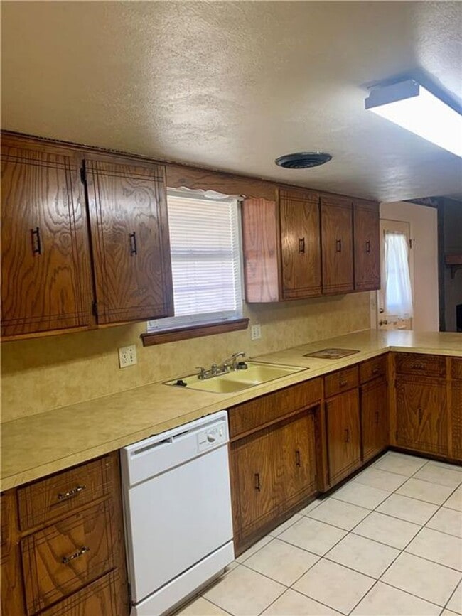 Building Photo - Charming Home with Open Kitchen, Fireplace & 2-Car Garage