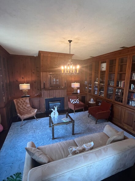 Paneled library with floor to ceiling book cases - 5553 Little Falls Rd
