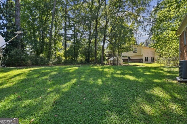 Building Photo - 5659 Whispering Pines Rd