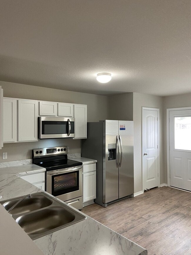 Building Photo - Now Pre-Leasing — Spacious 4-Bed, 2-Bath Home in Conrad Court Available 6/26