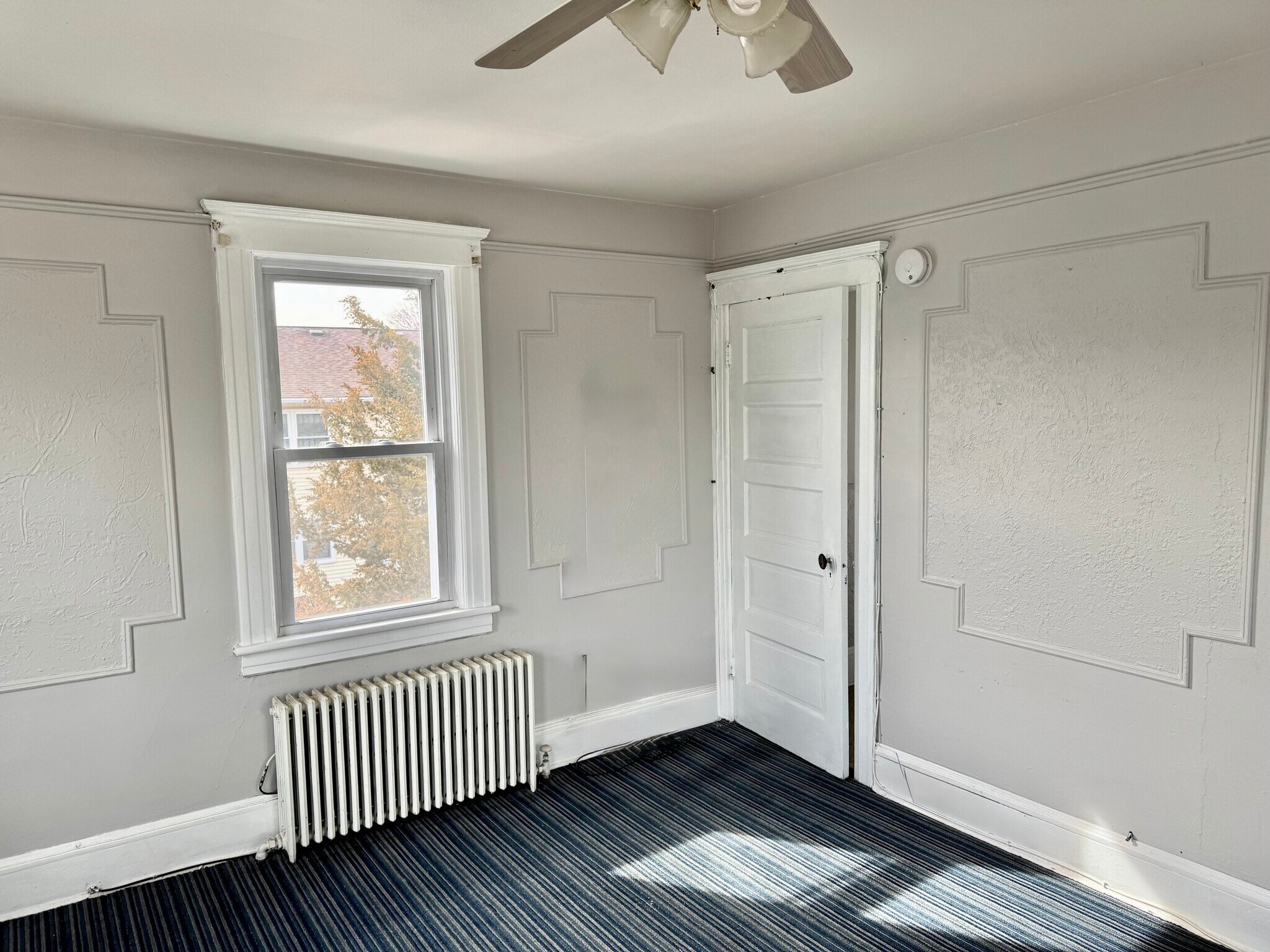 Right side of living room, with door to hallway. - 306 W Camplain Rd