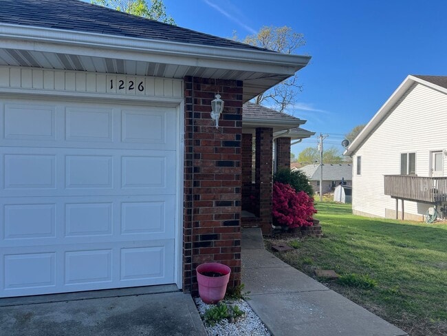 Building Photo - COMING SOON! All-Brick Duplex near Nixa High School
