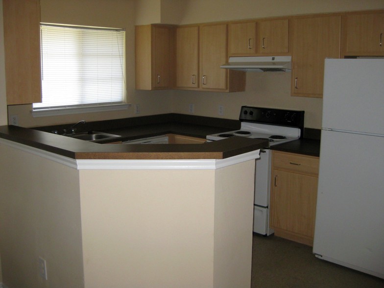 A home is never home without a kitchen and your cookin'! - Village at Meadowbend