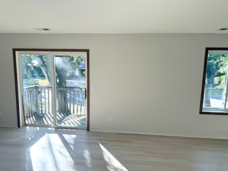 Sunny, open living room - 6531 Channel Rd NE
