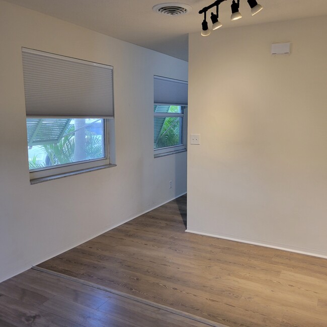 dining area with track lighting - 2031 NE 56th St