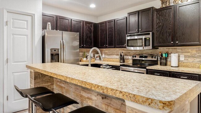 Building Photo - 3 Bedroom 3 Bath Kissimmee Emerald Lake Townhome with 2 Master Suites and Stainless Appliances!