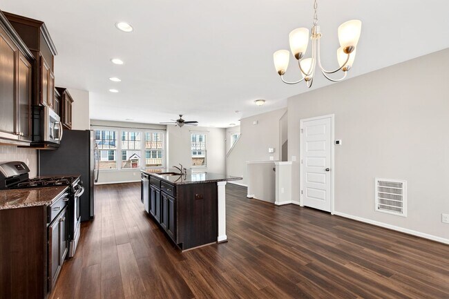 Building Photo - Beautiful 4BR End-Unit Townhome in Prime Apex Location!