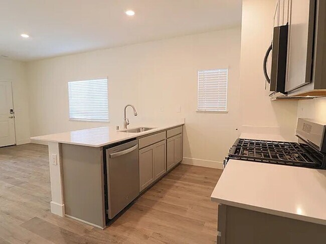 Building Photo - BRAND NEW - GRANITE - STAINLESS - LVP - CE...