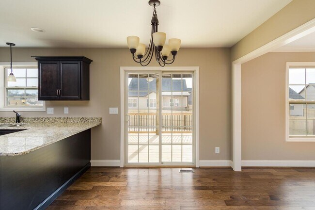 Building Photo - Pet Friendly Three Bedroom with Bonus!