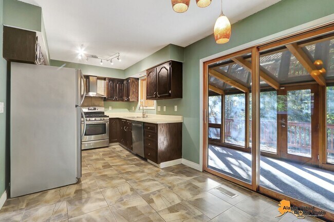 Building Photo - Eagle River Home w/ Fenced Yard, Sunroom, and Garage!