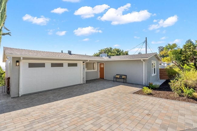 Building Photo - "Remodeled - Charming 3-Bed Sanctuary with...