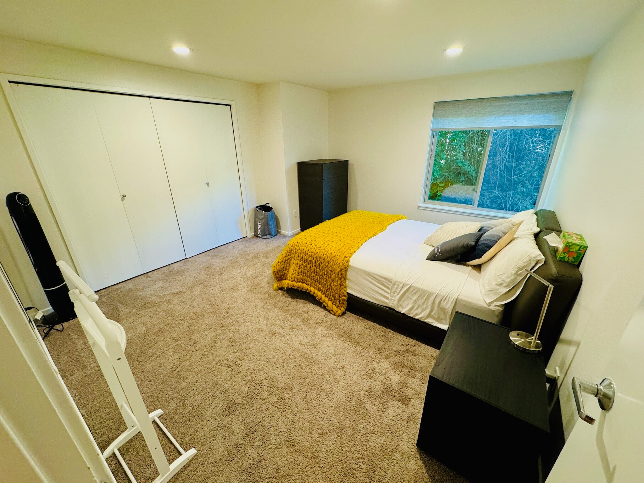 Generously sized primary bedroom featuring plush wall-to-wall carpeting & natural light - 2145 Dexter Ave N