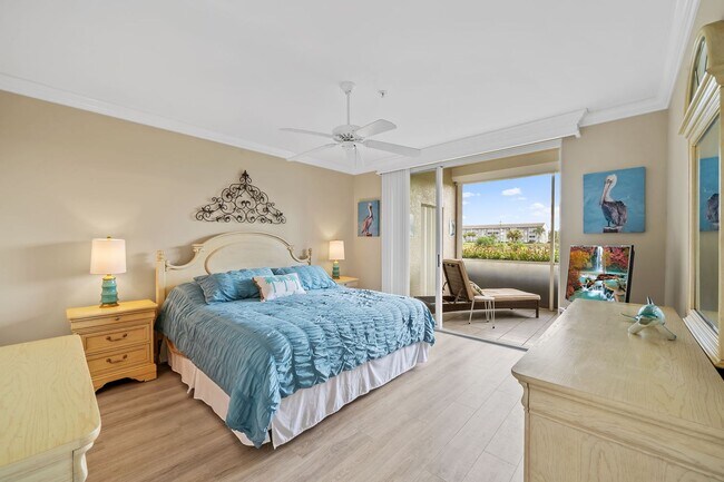 Building Photo - first-floor unit featuring a 2 bedroom, 2 bath fully furnished