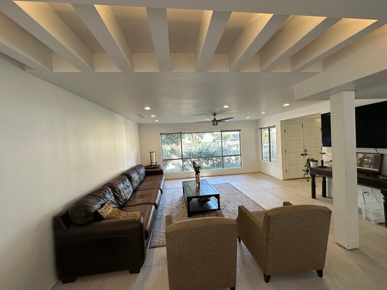 The spacious living room showcases the home's impressive front-to-back sight line. - 5214 Dawes Ave