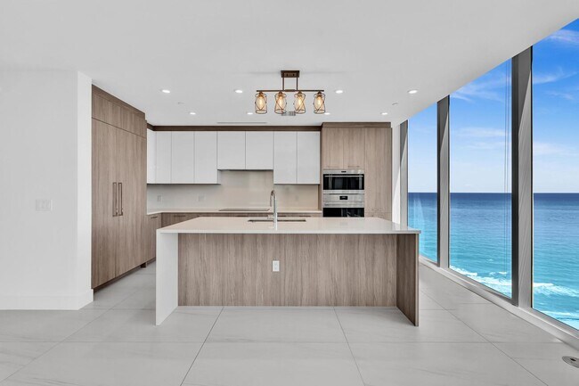 Building Photo - Stunning High-Rise Condo with Ocean Views | Prime Beach Location