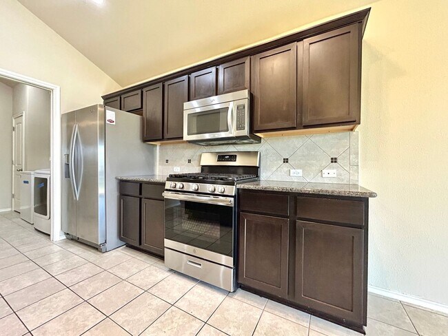 Building Photo - Charming 3-Bedroom Home with Open Layout & Covered Patio!