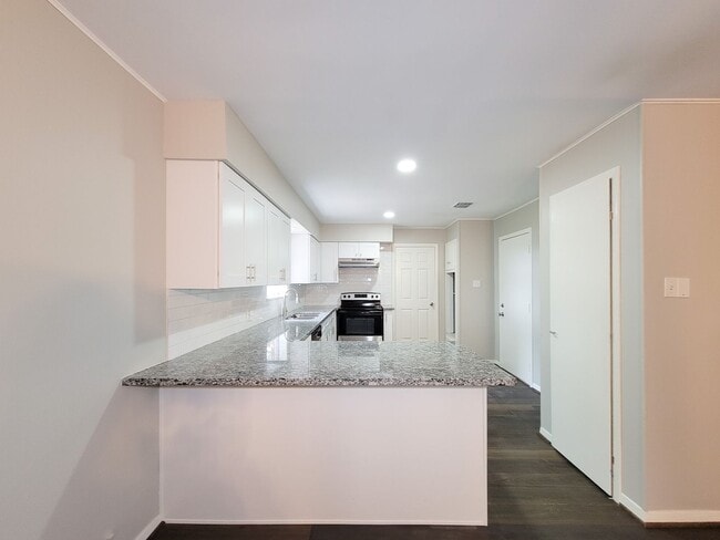 Building Photo - Welcome to your dream rental! This meticulously remodeled 3-bedroom, 2-bathroom home in the heart...
