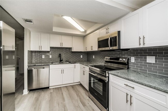 Building Photo - 12906 Kings Manor Ave