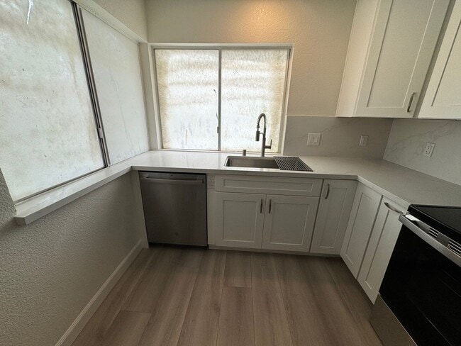 Building Photo - Total remodel - New kitchen, new bathroom, new appliances, new electrical, new paint, new floors