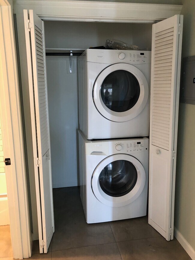 Washer and dryer in closet in hallway. - 344 1/2 N Bixel St