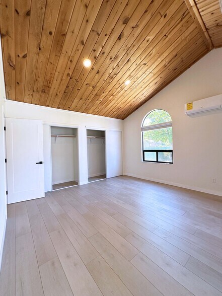 Bright and airy master suite with vaulted ceiling, two built-in closets, and private patio entry. - 4570 58th St