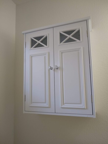 storage cabinet in guest bathroom - 14572 Dickens St