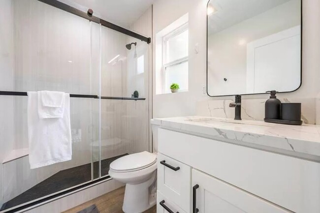 The master bathroom is ensuite and includes additional storage closet. - 3355 Lloyd St