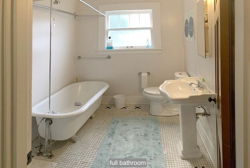 full bathroom with clawfoot tub shower and ¾ shower - 631 N Garden St
