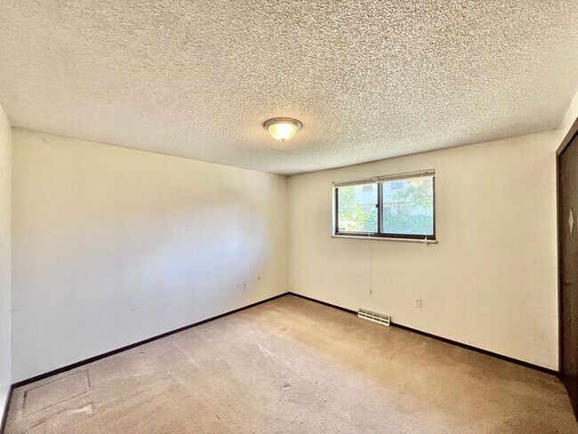 Building Photo - NEW PAINT, FLOORING & APPLIANCES! 2 Bedroo...