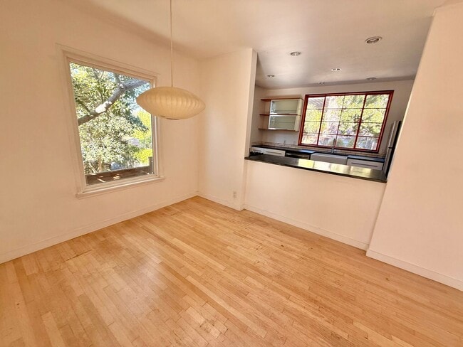 Building Photo - Hilltop Highland Park Sanctuary with Views, Private Gated Yard, In Unit Laundry, Parking & Abunda...