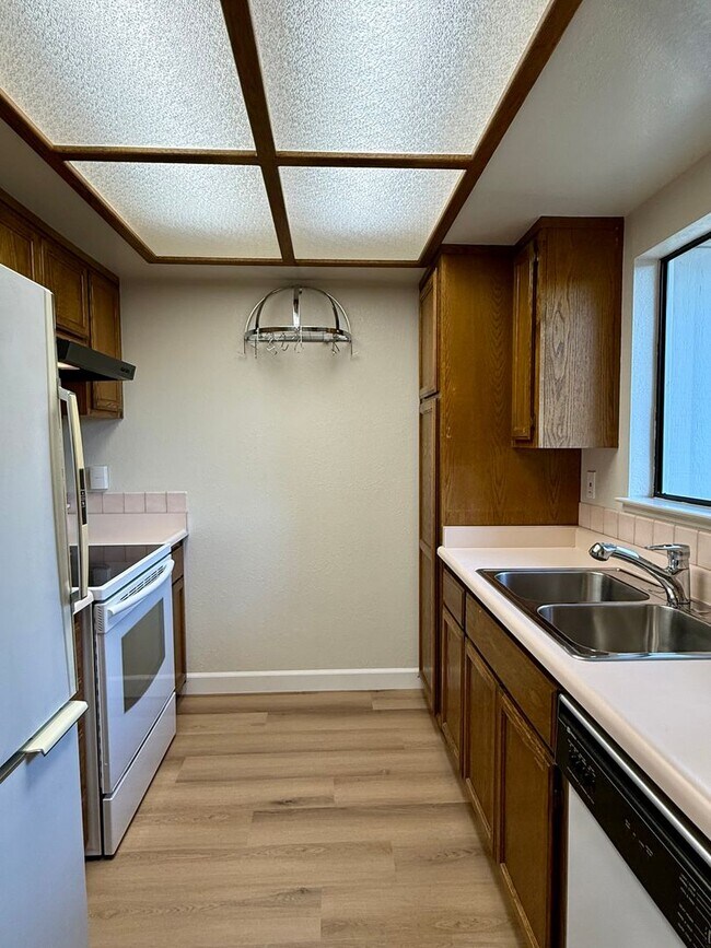 Building Photo - New Vinyl Plank Flooring, Fresh Interior Paint, 1 Car Garage + 1 Assigned Outdoor Parking Space -...