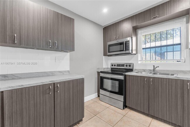 Building Photo - 6940 NW 6th Ct