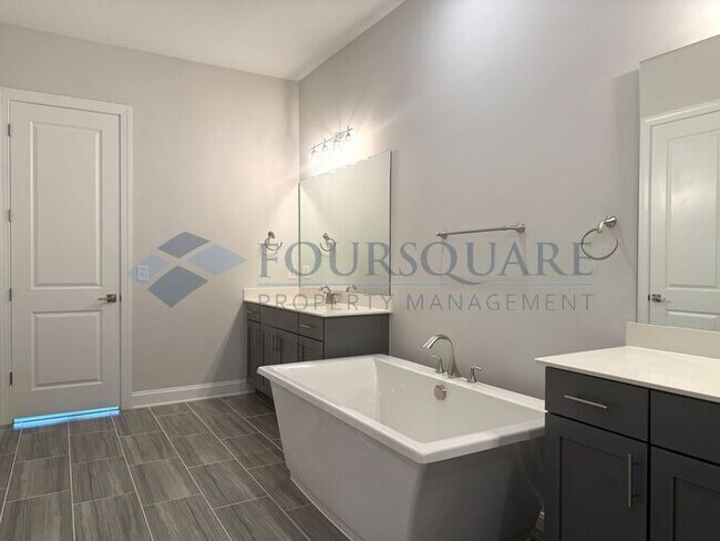 Building Photo - Elegant 4-Bed / 3.5-Bath Home with Main-Level Primary Suite, Quartz Kitchen & 3-Car Garage – In H...