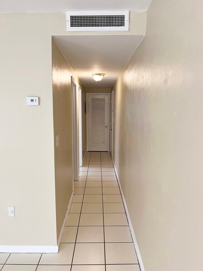 Hallway leading to front door bathroom, bedroom and front door - 419 Ocean Ave
