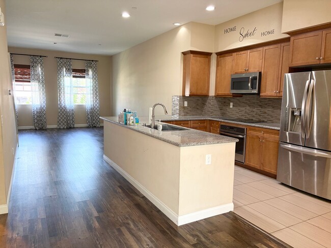 Building Photo - Stylish 3-Story Townhome with Balconies & Open-Concept Living