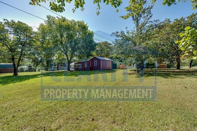 Building Photo - Updated house with carport and shed on corner lot!