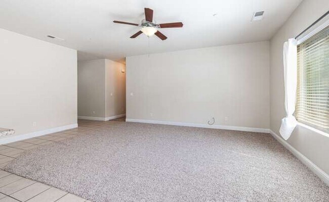 Building Photo - Four bedroom/2-bath home with 2-car garage