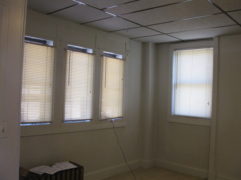 Living Room - New carpet to be installed in living room and hallway soon - 432 E 7th St