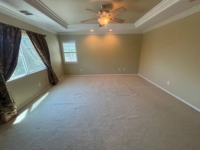 Building Photo - Spacious 4-Bedroom Home with Community Ame...