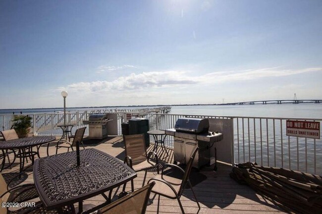 Building Photo - Beautiful waterfront condo in the gated co...