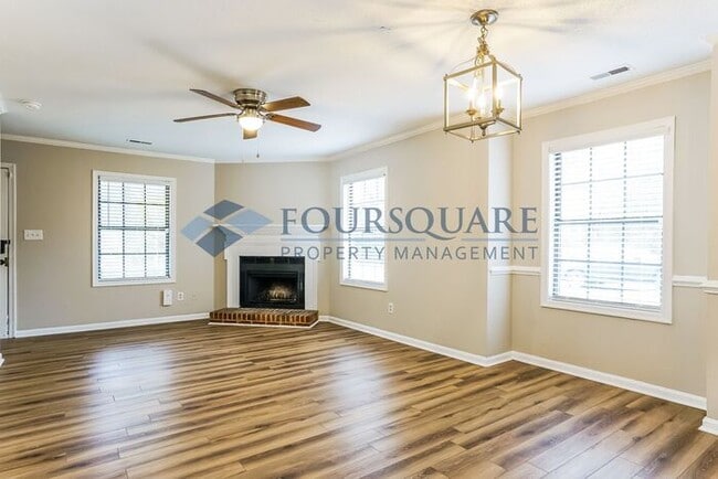 Building Photo - Inviting 2-Bed Townhome with Front Porch, Private Parking  & Storage