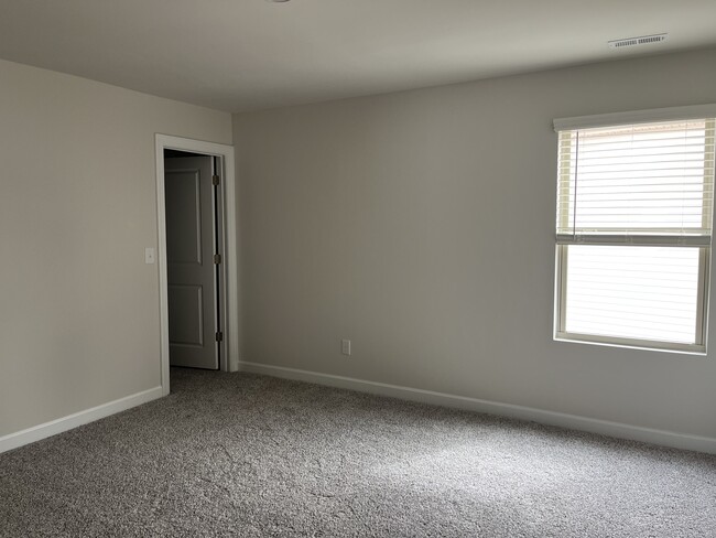 Upstairs room 2 with walk-in closet. - 4111 Honey Locust Dr