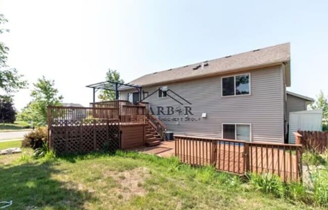 Building Photo - Updated 4 Bedroom Home with Remodeled Kitchen & Tiered Deck
