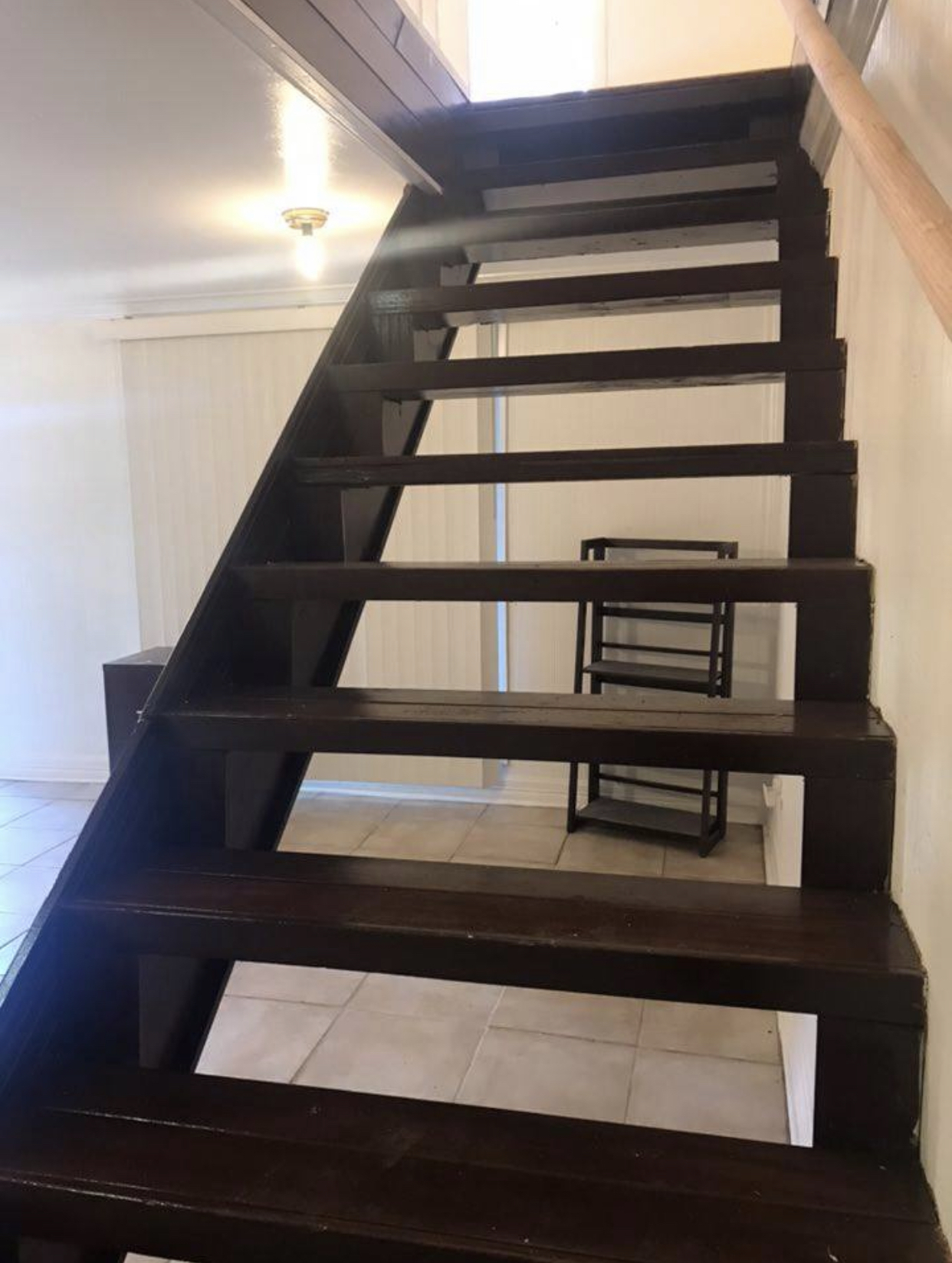 living area seen through stairs - 2515 Riverside Dr